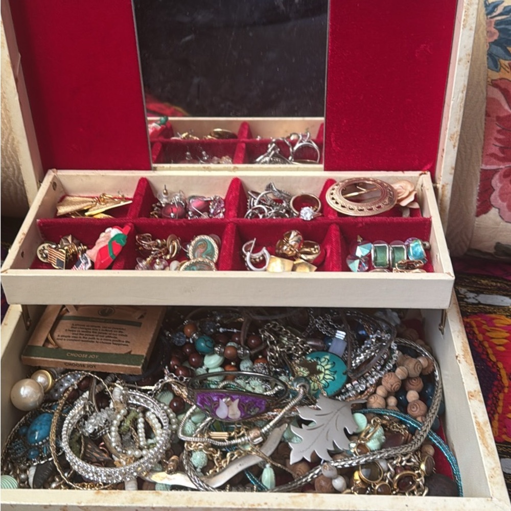 Box full of vintage jewelry